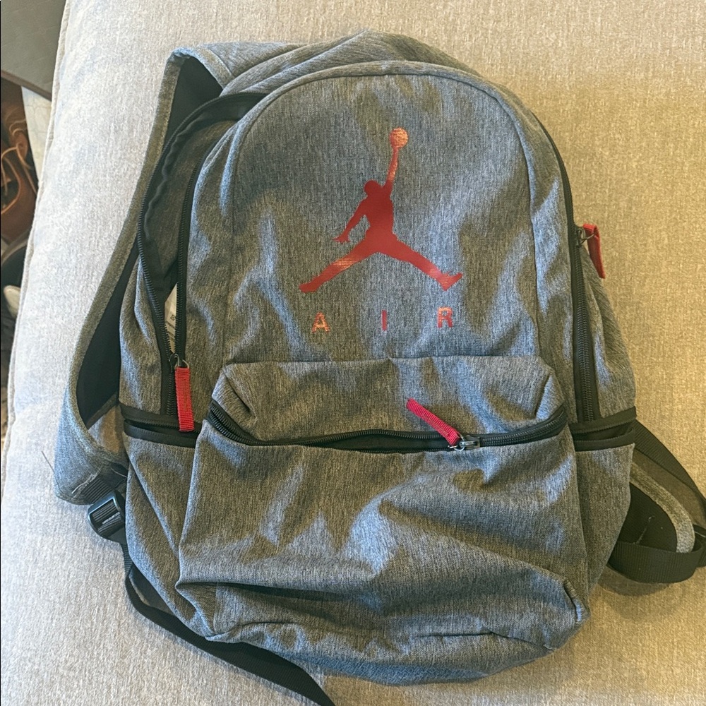 Nike Jordan Air Gray Backpack with Red Accents